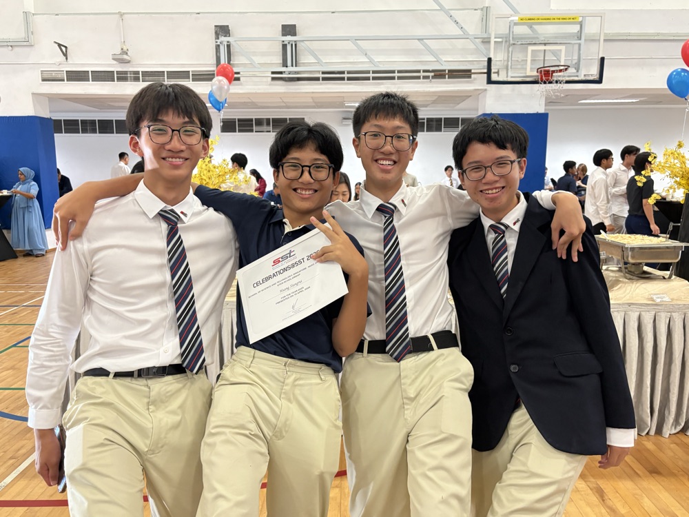 Certificate in hand at an evening event