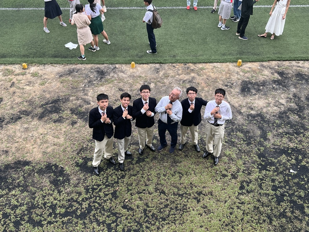 Looking up at a drone from the school field